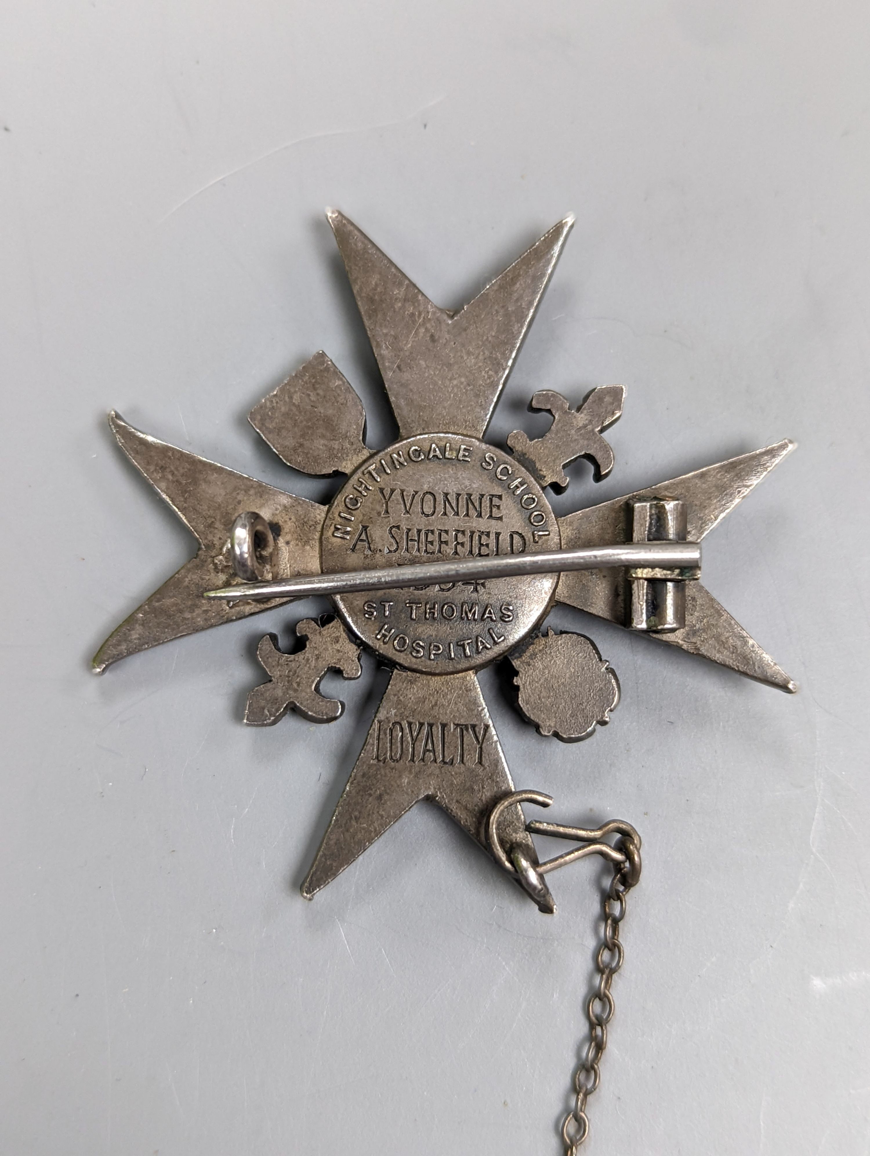 An enamelled Nightingale School, St. Thomas Hospital Loyalty badge, 1954, 37mm.
